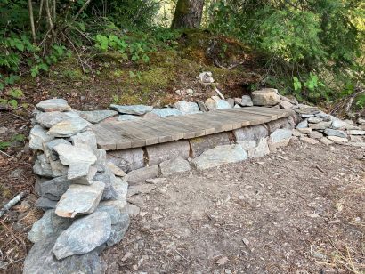 low bench made from rock and wood